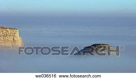 Hills in fog. La Puebla de Albort? n. Zaragoza province. Arag? n. Spain. View Large Photo Image Stock Photograph - Hills in fog. La Puebla de Albort? n. Zaragoza province. Arag? n. Spain.. Fotosearch
