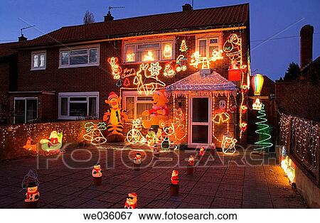 Stock Photo - House with christmas decorations on house. Fotosearch