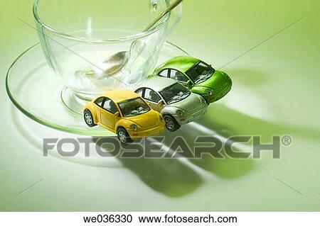 Miniature cars and cup View Large Photo Image Stock Image - Miniature cars and cup. Fotosearch