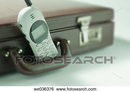 Stock Photograph - Mobile phone and briefcase. Fotosearch