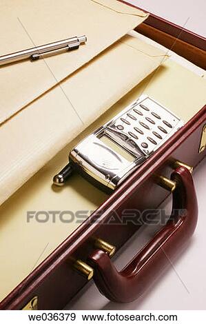 Mobile phone and files in briefcase View Large Photo Image Stock Photo - Mobile phone and files in briefcase. Fotosearch