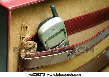 Stock Photo - Mobile phone in briefcase. Fotosearch