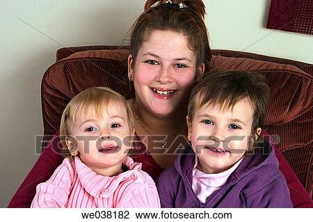 Mother and her two young daughters View Large Photo Image Stock Image - Mother and her two young daughters. Fotosearch