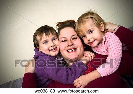 Mother and her two young daughters View Large Photo Image Stock Image - Mother and her two young daughters. Fotosearch