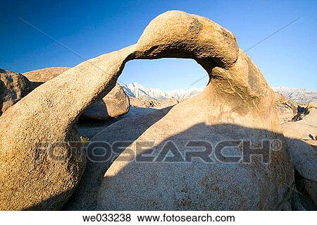 Stock Photo - Natural stone arch in the Alabama Hills, Eastern Sierras. Bishop, California, USA. Fotosearch
