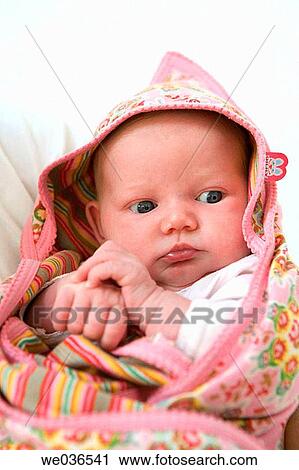 Stock Image - Newborn baby wrapped in a towel. Fotosearch