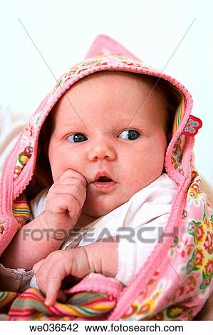 Newborn baby wrapped in a towel View Large Photo Image Stock Image - Newborn baby wrapped in a towel. Fotosearch