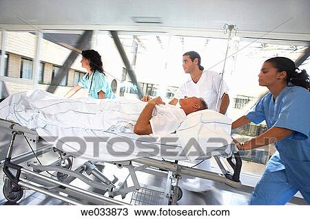 Nurses carrying patient View Large Photo Image Stock Image - Nurses carrying patient. Fotosearch