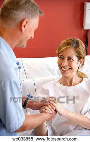 Patient and relative in hospitalization View Large Photo Image Stock Photo - Patient and relative in hospitalization. Fotosearch