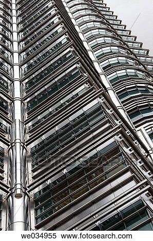 Petronas Twin Towers, Kuala Lumpur, Malaysia. The tallest twin towers in the world (452 m, 88 storeys). Architect: Cesar Pelli. Tapering twin towers (connected by a sky bridge) share an Islamic-influenced geometrically polygonal plan. View Large Photo Image Stock Photography - Petronas Twin Towers, Kuala Lumpur, Malaysia. The tallest twin towers in the world (452 m, 88 storeys). Architect: Cesar Pelli. Tapering twin towers (connected by a sky bridge) share an Islamic-influenced geometrically polygonal plan.. Fotosearch