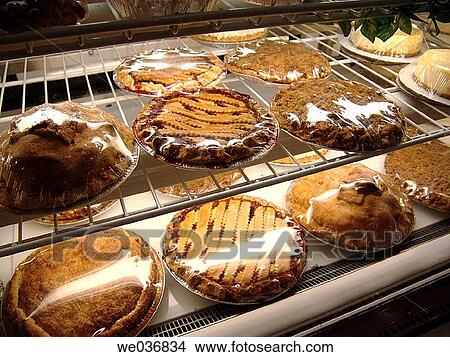 Pies and cakes for sale at a bakery View Large Photo Image Picture - Pies and cakes for sale at a bakery. Fotosearch