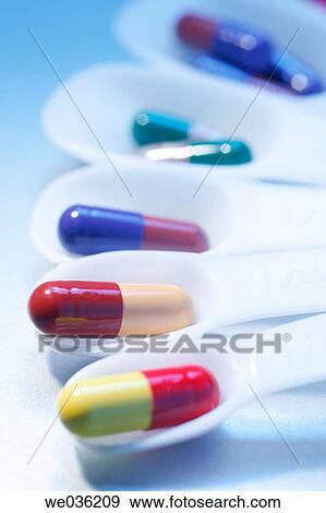 Pills on measuring spoons View Large Photo Image Stock Photo - Pills on measuring spoons. Fotosearch