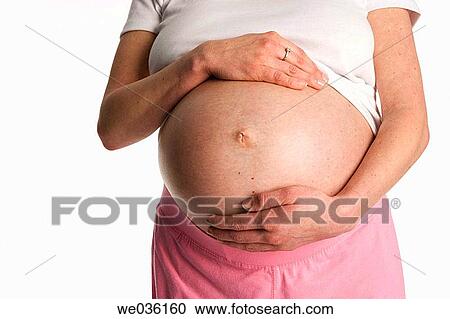 Pregnant belly with hands View Large Photo Image Stock Image - Pregnant belly with hands. Fotosearch
