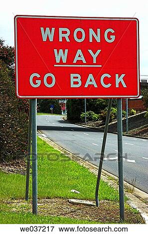 Stock Photo - Road sign warning of progress in the wrong direction. Fotosearch