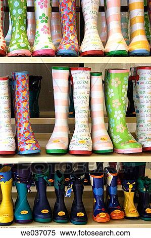 Rubber boots on display before a shop View Large Photo Image Stock Photography - Rubber boots on display before a shop. Fotosearch