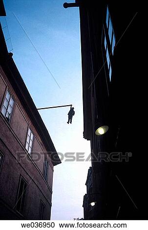 Sculpture of man holding onto pole three flights up, over street. Prague, Czech Republic View Large Photo Image Stock Image - Sculpture of man holding onto pole three flights up, over street. Prague, Czech Republic. Fotosearch