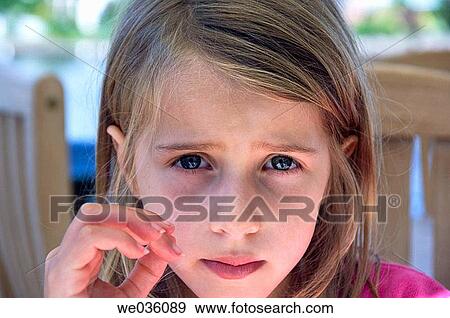 Seven year old little girl with anxious eyes View Large Photo Image Stock Photo - Seven year old little girl with anxious eyes. Fotosearch