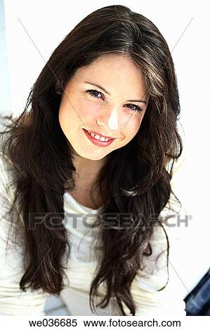 Stock Photography - Sexy 30's caucasian woman smiling in camera. Fotosearch