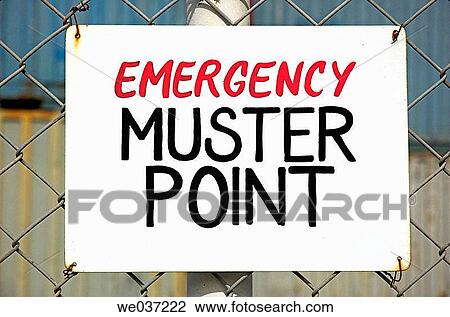 Sign on fence indicating location of emergency muster point View Large Photo Image Stock Image - Sign on fence indicating location of emergency muster point. Fotosearch