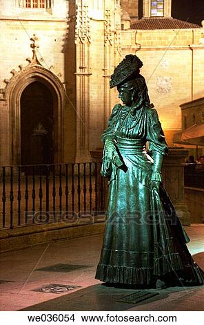 Picture - Statue of? La Regenta? (? The Regent's Wife?, a character from the famous novel of the same name), by sculptor Mauro? lvarez, Cathedral in background. Plaza de Alfonso II el Casto, Oviedo. Asturias, Spain. Fotosearch