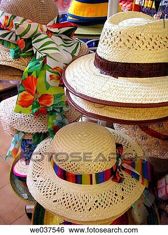 Stock Photograph - Straw hats for sale. Majorca, Balearic Islands, Spain. Fotosearch