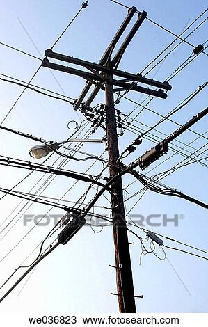 Telephone pole with wires and lamppost. View Large Photo Image Stock Image - Telephone pole with wires and lamppost.. Fotosearch