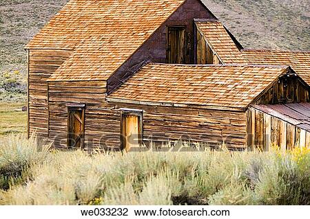 Stock Image - View of old wooden buildings of the ghost town, Bodie State Historic Park. Bodie, California, USA. Fotosearch
