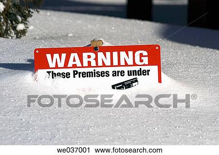 Stock Image - Warning sign in snow. Fotosearch