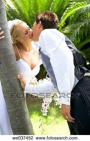 Wedding couple kissing View Large Photo Image Stock Image - Wedding couple kissing. Fotosearch