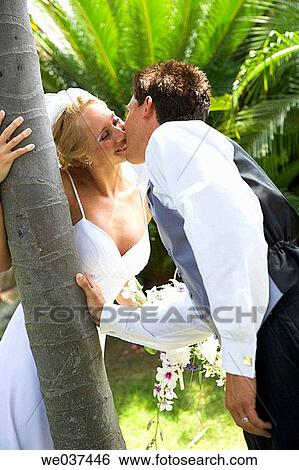 Wedding couple kissing View Large Photo Image Stock Photograph - Wedding couple kissing. Fotosearch