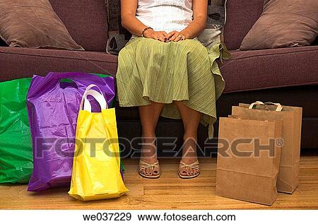 Woman rests after a hard day shopping. View Large Photo Image Stock Photo - Woman rests after a hard day shopping.. Fotosearch