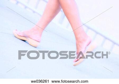 Woman walking along a beach. Feet abstract. July 2005, Maryland, USA View Large Photo Image Stock Image - Woman walking along a beach. Feet abstract. July 2005, Maryland, USA. Fotosearch