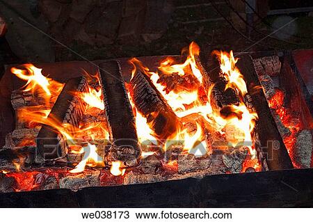 Wood burning on an outdoor fire View Large Photo Image Stock Image - Wood burning on an outdoor fire. Fotosearch