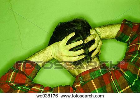 Young man, with his hands on his head, posing with his back to the camera View Large Photo Image Stock Photograph - Young man, with his hands on his head, posing with his back to the camera. Fotosearch
