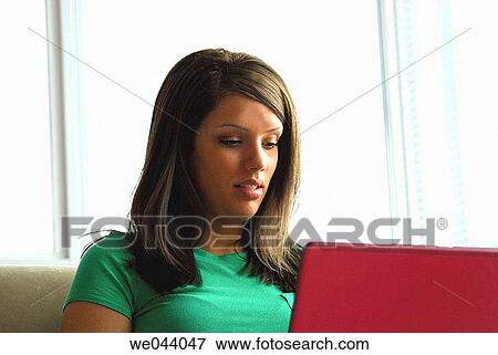 19 years old girl working on laptop computer at home in apartment. t View Large Photo Image Stock Photo - 19 years old girl working on laptop computer at home in apartment. t. Fotosearch
