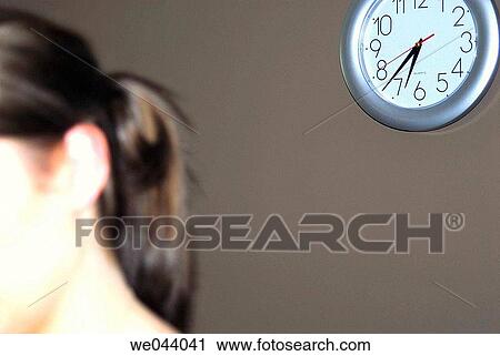 20 years old girl, at home, clock on wall behind her. View Large Photo Image Stock Image - 20 years old girl, at home, clock on wall behind her.. Fotosearch