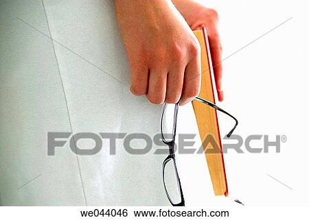 20 years old girl holding glasses and red book. View Large Photo Image Stock Photograph - 20 years old girl holding glasses and red book.. Fotosearch