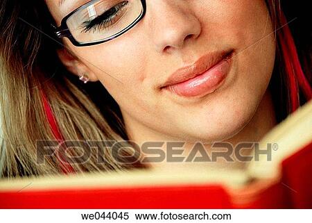 20 years old girl reading old red book with glasses on. View Large Photo Image Stock Photography - 20 years old girl reading old red book with glasses on.. Fotosearch