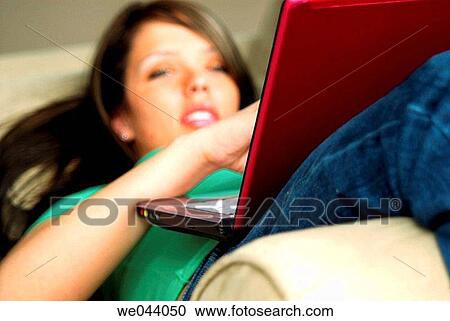 20 years old girl working on laptop computer on sofa. View Large Photo Image Stock Image - 20 years old girl working on laptop computer on sofa.. Fotosearch