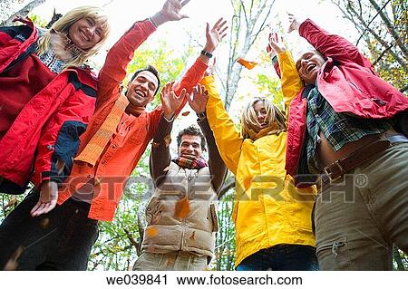 Stock Image - 30's, autumn, Arms raised, amusement, 20's. Fotosearch
