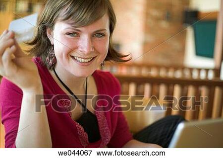 Stock Photo - 30's, Bank card, at-home, 20's. Fotosearch