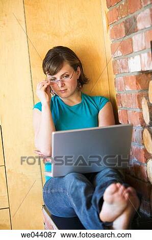 Stock Photo - 30's, barefoot, at-home, 20's. Fotosearch