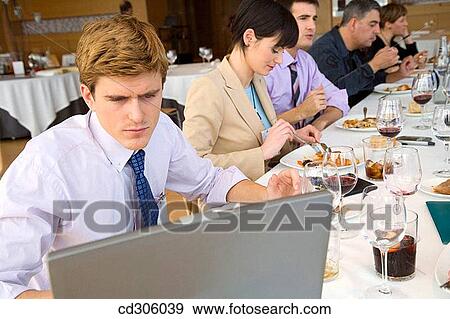 Stock Photo - 30's, businessman, Business lunch, business, 20's. Fotosearch