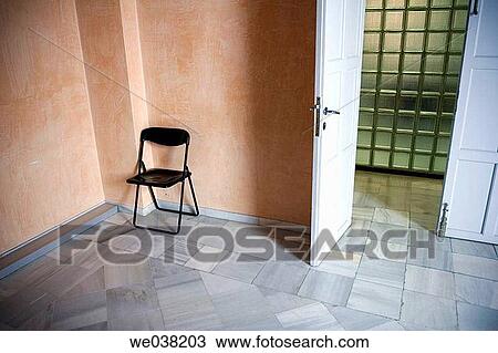Stock Image - absent, corner, concept, chair, absence. Fotosearch