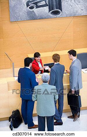 Admission desk, businessman, business, briefcase, accreditation View Large Photo Image Picture - Admission desk, businessman, business, briefcase, accreditation. Fotosearch