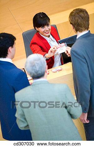 Stock Image - Admission desk, businessman, business, accreditation. Fotosearch