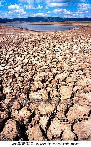 Agriculture. Drought. Cracked earth. Empty dam. View Large Photo Image Stock Image - Agriculture. Drought. Cracked earth. Empty dam.. Fotosearch