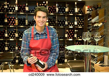 Stock Photo - apron, bottle, black hair, 30's. Fotosearch