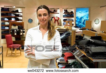 Arms crossed, Clothing store, arms folded, 30's View Large Photo Image Stock Image - Arms crossed, Clothing store, arms folded, 30's. Fotosearch