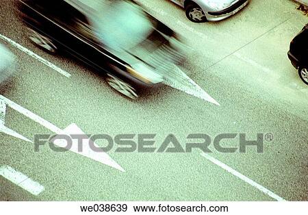 Stock Photo - asphalt, car, blurred motion, automobile, arrow. Fotosearch